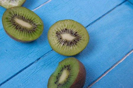 Mix of fresh green fruits on the wooden turquoise background. Mock up, copy space for your text.の写真素材