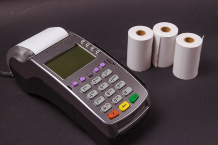 Payment terminal with contactless credit card and polish currency, choice between cashless or cash paying for shopping or productsの写真素材
