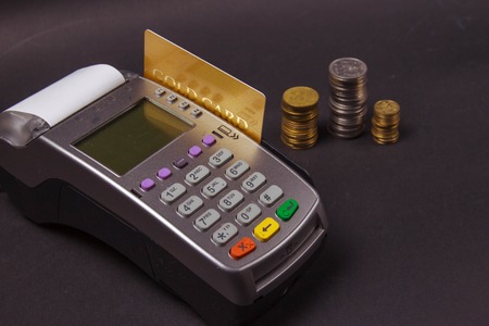 Payment terminal with contactless credit card and polish currency, choice between cashless or cash paying for shopping or productsの写真素材
