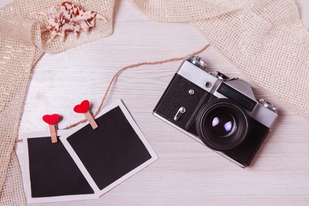 Camera Christmas wooden background. New Year's holiday. Christmas motive. On a wooden surface. Top view. Free space for your text.の写真素材