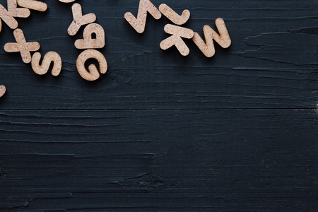 Close up wooden alphabet study english letter,ABC on the blackbroad as a background compositionの写真素材