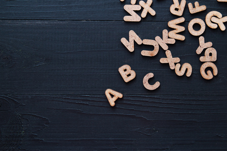 Close up wooden alphabet study english letter,ABC on the blackbroad as a background compositionの写真素材