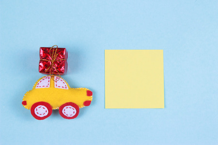 toy of felt yellow typewriter with red gift with pencils and place for text. Top viewの写真素材