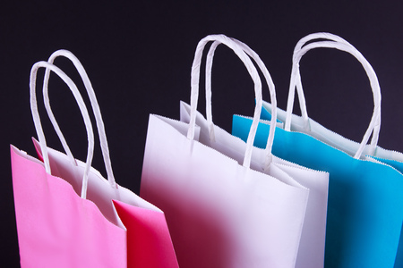 Colour shopping bags on black backgroundの写真素材
