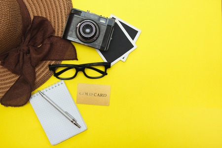 Top view of concept the travel or vacation. Equipment of the travel on the yellow background. Travel vacation concept.の写真素材