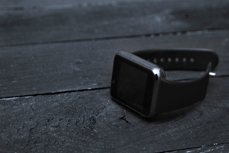Gold smart watches with black screen.Place mobile app logo on touchscreen.Luxury watch on...