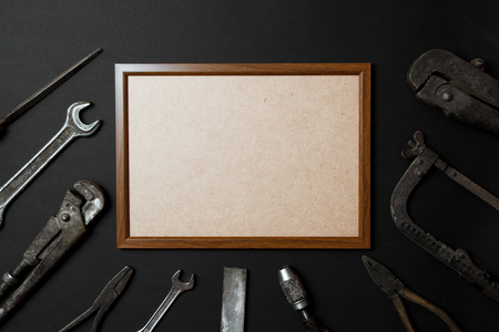 Fathers day greeting card concept. Vintage old tools on black paper background. Flat lay. Copy spaceの写真素材