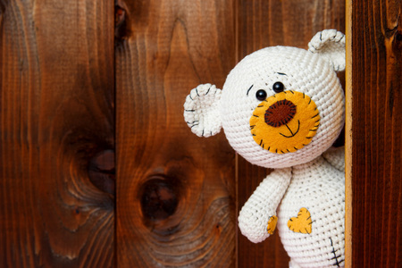 Cute teddy bear with old wood backgroundの写真素材