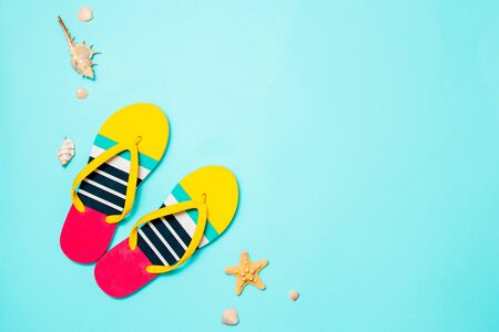 Summer fun time and accessories on blue background. Top view and copy space.の写真素材