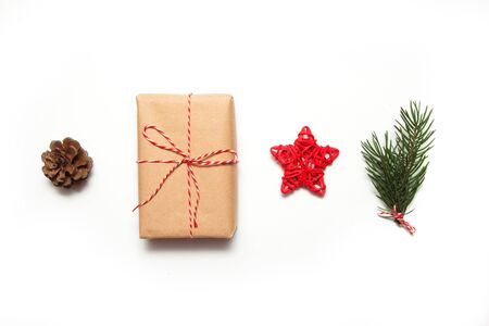 Christmas composition. Christmas tree branch, pine, gift and decorations on white background. Flat lay, top view, copy spaceの写真素材