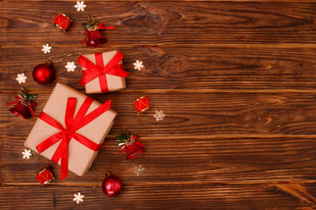 Christmas composition. Christmas gifts with decoration on wooden background. Greeting card concept....