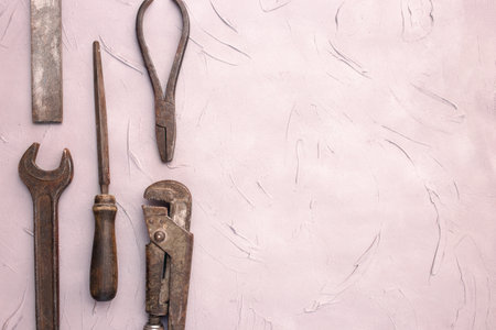 Fathers day or labor day greeting card concept. Vintage old tools on grey concrete background. Copy spaceの写真素材