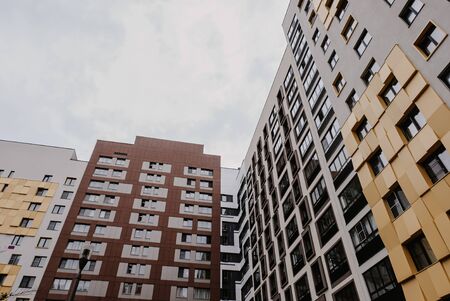 residential high-rise buildings against the gray skyの写真素材