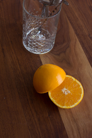 Sliced Orange on a warm walnut backgroundの写真素材