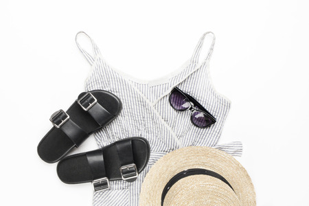 Collection collage of women's clothing. Sundress-dress, straw hat, sunglasses, sandals. Top view, flat lay.の写真素材