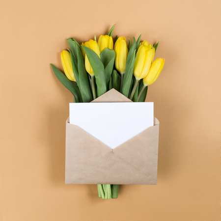 Envelope on the background of tulips. Happy mother's dayの写真素材