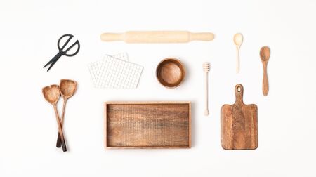 Wooden kitchen utensils on white background. Flat lay, top view.の写真素材