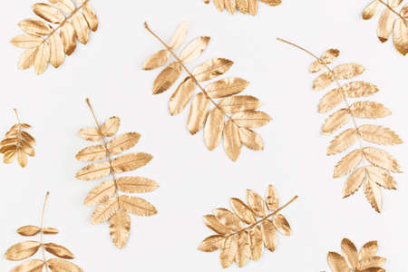 Autumn composition. Pattern made of autumn golden leaves on white background. Flat lay, top view,...