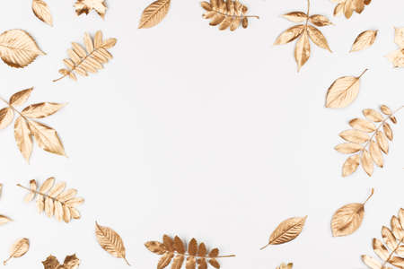 Autumn composition. Frame made of autumn golden leaves on white background. Flat lay, top view, copy...