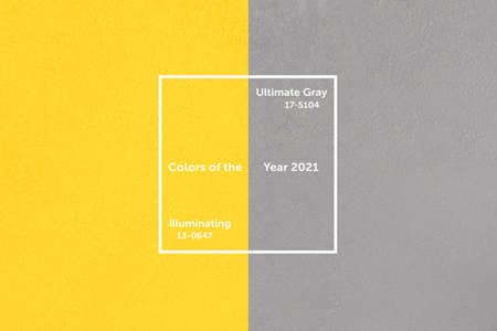 Illuminating and Ultimate Gray concrete wall. Trendy yellow, gray colors of the year 2021.の写真素材