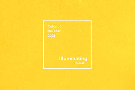 Illuminating concrete wall. Trendy yellow color of the year 2021.の写真素材