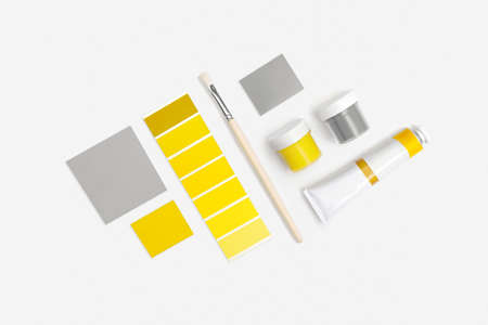 Illuminating, Ultimate Gray paints and paint brushes white background. Colors of the year 2021. Top...