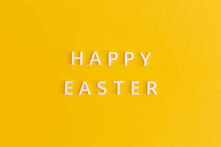 Happy Easter lettering on a yellow backgroundの写真素材