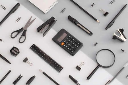 Pattern composition of office and school stationery on white, gray background. Back to school