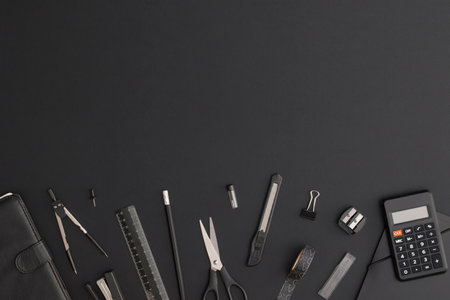 Office and school stationery on black leather background. Back to schoolの写真素材