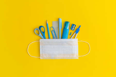 School stationery on a yellow background. Top view with copy space. Flat lay. Back to school...