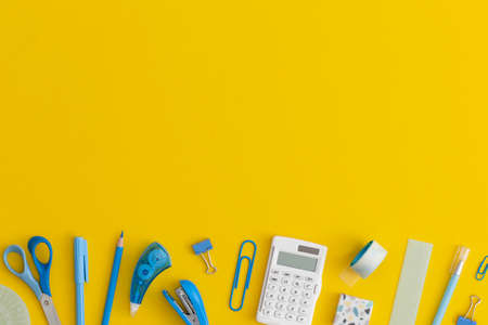 School stationery on a yellow background. Top view with copy space. Flat lay. Back to school...