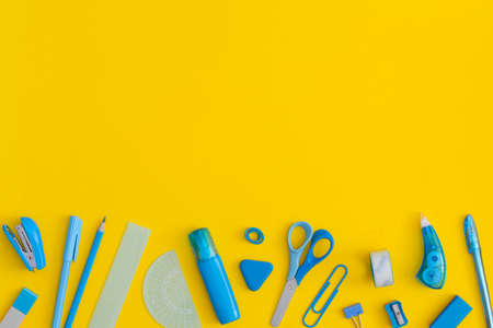 School stationery on a yellow background. Top view with copy space. Flat lay. Back to school...