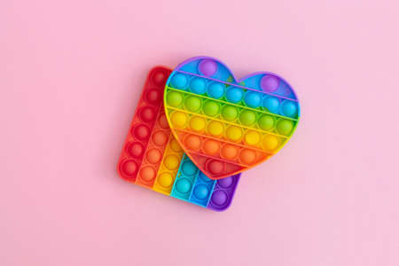 Colorful anti-stress sensory toys for children on pink background.の写真素材