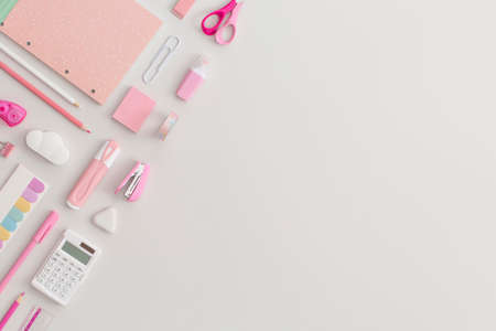 Pink school stationery on a gray background. Top view. Flat lay. Back to school concept.