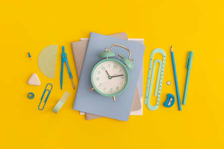 School stationery on a yellow background. Top view with copy space. Flat lay. Back to school...