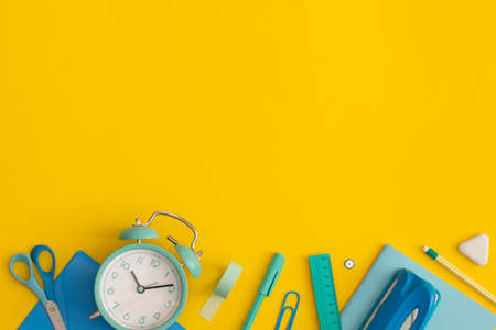 School stationery on a yellow background. Top view with copy space. Flat lay. Back to school...