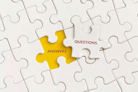 White details of puzzle with the text Answer and Question on yellow background.の写真素材