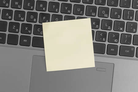 Mock up colored sticky notes on laptop. Business concept, strategy, planning