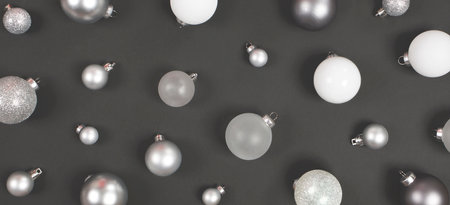 Christmas balls pattern on a black background. Flat lay, top view