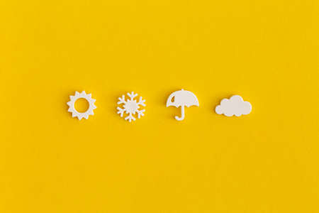 Weather icons set on yellow background. Weather forecast concept.の写真素材