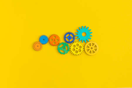 gears on yellow backgroundの写真素材