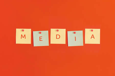 Mock up sticky notes with MEDIA on red background. Business concept, strategy, planningの写真素材