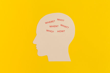 Human head with gears on yellow backgroundの写真素材
