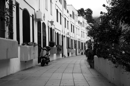 Scooter in the street. White house. Spain, Andalusia, Costa del Sol.の写真素材