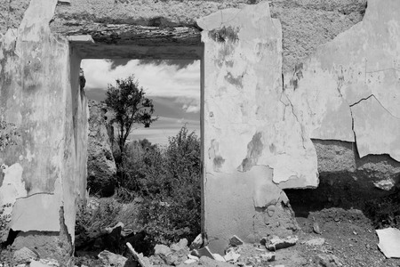 Ruins. Old abandoned rural house. Antique architecture. Black and white.の写真素材
