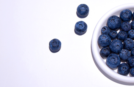 Blueberry. Close-up view of fresh blueberries isolated on white background.の写真素材