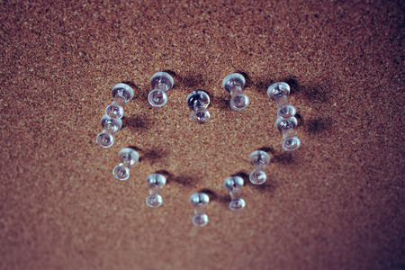 Heart. Heart of button on a brown background.の写真素材