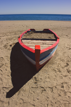 Boat. Lonely boat on the beach in Estepona.の写真素材