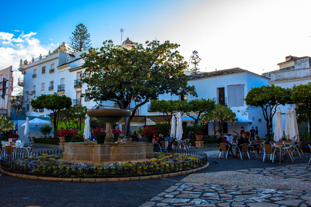 Square. A small square with restaurants and a fountain in Estepona. Malaga province, Andalusia,...
