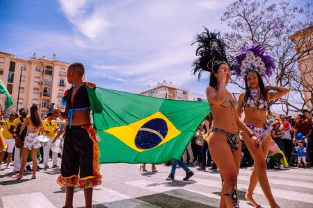 25th INTERNATIONAL VILLAGES FAIR in Fuengirola. The multicultural parade, in which all the delegations at each edition of? FIP? take part Andalusia, Spain. Picture taken? 1 May 2019.のeditorial素材